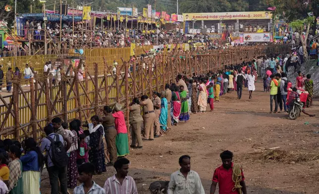 Villagers gather for the Jallikattu bull-taming event at the annual harvest festival called Pongal in Palamedu village on the outskirts of Madurai, India, Friday, Jan. 16, 2026. (AP Photo/Mahesh Kumar A.)