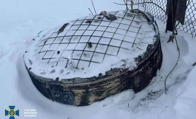 This photo provided by the Ukrainian Security Service on Friday, Jan. 9, 2026, shows a fragment believed to be a part of a Russian Oreshnik intermediate range hypersonic ballistic missile that hit the Lviv region. (Ukrainian Security Service via AP)