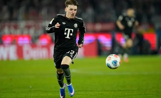 Bayern's Lennart Karl controls the ball during the German Bundesliga soccer match between 1.FC Koeln and FC Bayern Munich in Cologne, Germany, Wednesday, Jan. 14, 2026. (AP Photo/Martin Meissner)