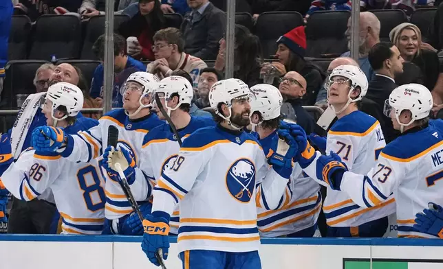 Buffalo Sabres' Alex Tuch (89) celebrates with teammates after scoring a goal during the second period of an NHL hockey game against the New York Rangers Thursday, Jan. 8, 2026, in New York. (AP Photo/Frank Franklin II)