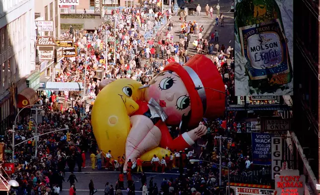 FILE - Betty Boop collapses on Broadway near 49th Street as handlers work to raise the deflated helium balloon during the Macy's Thanksgiving Day Parade in New York. (AP Photo/Ron Frehm, File)
