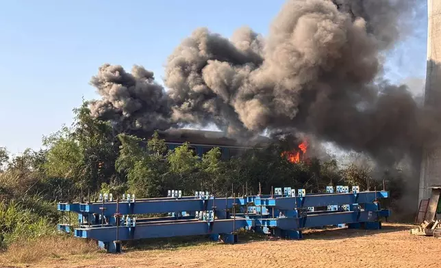 This photo released from Thailand's Ministry of Transport, shows a scene after a construction crane fell into a passenger train in Nakhon Ratchasima province, Thailand Wednesday, Jan. 14, 2026. (Ministry of Transport via AP)