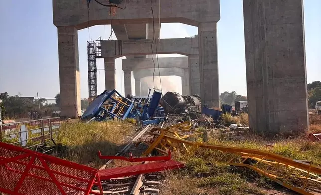 This photo released from State Railway of Thailand, shows a scene after a construction crane fell into a passenger train in Nakhon Ratchasima province, Thailand Wednesday, Jan. 14, 2026. (State Railway of Thailand via AP)
