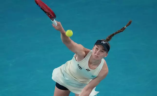 Elena Rybakina of Kazakhstan serves the ball to Aryna Sabalenka of Belarus during the women's singles final at the Australian Open tennis championship in Melbourne, Australia, Saturday, Jan. 31, 2026. (AP Photo/Dar Yasin)