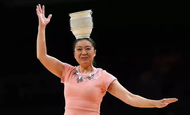 Red Panda performs during halftime of an NCAA college basketball game between Miami and Stanford in Coral Gables, Fla., Wednesday, Jan. 28, 2026. (AP Photo/Rebecca Blackwell)