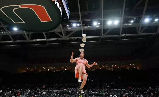 Red Panda performs during halftime of an NCAA college basketball game between Miami and Stanford in Coral Gables, Fla., Wednesday, Jan. 28, 2026. (AP Photo/Rebecca Blackwell)