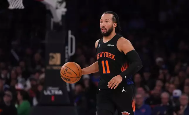 New York Knicks' Jalen Brunson looks to pass during the first half of an NBA basketball game against the Portland Trail Blazers Friday, Jan. 30, 2026, in New York. (AP Photo/Frank Franklin II)