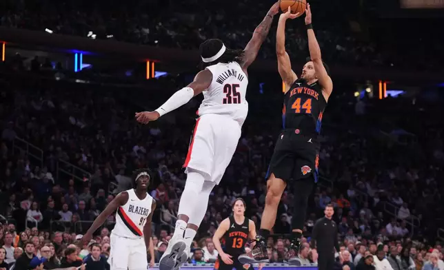 Portland Trail Blazers' Robert Williams III (35) blocks a shot by New York Knicks' Landry Shamet (44) during the first half of an NBA basketball game Friday, Jan. 30, 2026, in New York. (AP Photo/Frank Franklin II)