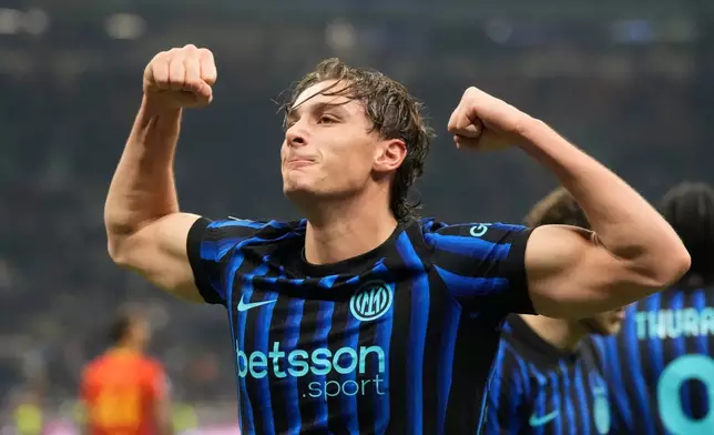 Inter Milan's Francesco Pio Esposito celebrates after scoring his side's opening goal during the Serie A soccer match between Inter Milan and Lecce in Milan, Italy, Wednesday, Jan. 14, 2026. (AP Photo/Luca Bruno)