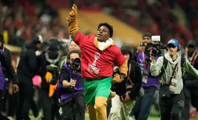 Darren Jason Watkins Jr., American YouTuber known as IShowSpeed, runs during the closing ceremony ahead of the Africa Cup of Nations final soccer match between Senegal and Morocco, in Rabat, Morocco, Sunday, Jan. 18, 2026. (AP Photo/Mosa'ab Elshamy)