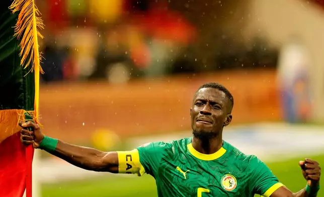 Senegal's Idrissa Gueye celebrates after winning the Africa Cup of Nations final soccer match between Senegal and Morocco, in Rabat, Morocco, Sunday, Jan. 18, 2026. (AP Photo/Themba Hadebe)