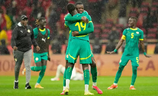 Sebegalese players celebrate after winning the Africa Cup of Nations final soccer match between Senegal and Morocco, in Rabat, Morocco, Sunday, Jan. 18, 2026. (AP Photo/Mosa'ab Elshamy)