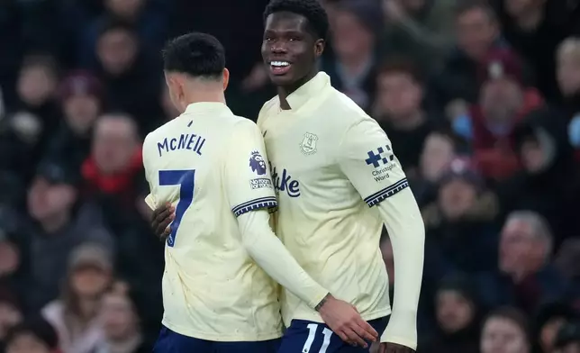 Everton's Thierno Barry, right, and Everton's Dwight McNeil celebrate scoring their side's first goal during the English Premier League soccer match between Aston Villa and Everton in Birmingham, Sunday, Jan. 18, 2026.(AP Photo/Dave Shopland)