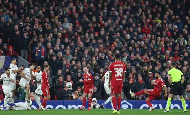 Liverpool's Mohamed Salah, second right, scores his side's third goal during the Champions League soccer match between Liverpool and Qarabag in Liverpool, Wednesday, Jan. 28, 2026. (AP Photo/Darren Staples)