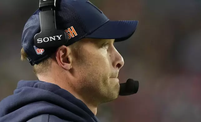 Chicago Bears head coach Ben Johnson watches during the first half of an NFL wild-card playoff football game against the Green Bay Packers Saturday, Jan. 10, 2026, in Chicago. (AP Photo/Nam Huh)