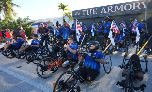 Wounded veterans prepare to start their ride in the annual Florida Keys Soldier Ride organized by the Wounded Warrior Project, Friday, Jan. 9, 2026, in Key Largo, Fla. (AP Photo/Lynne Sladky)