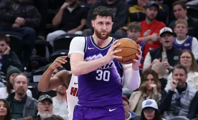 Utah Jazz center Jusuf Nurkic (30) rebounds the ball to complete a triple double against the Miami Heat during the second half of an NBA basketball game, Saturday, Jan. 24, 2026, in Salt Lake City. (AP Photo/Rob Gray)