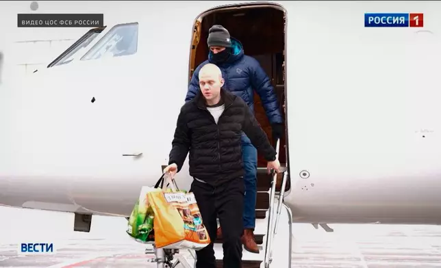 In this image, made from video and provided by Russian Federal Security Service via Russia-1 TV channel on Thursday, Jan. 8, 2026, Daniil Kasatkin, a Russian basketball player who was jailed in France and whose extradition was demanded by the United States, is seen after being released in a prisoner swap with France that saw the release of Laurent Vinatier, a French political scholar. (Russian Federal Security Service/Russia-1 TV channel via AP)