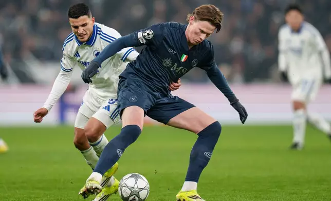 FC Copenhagen's Mohamed Elyounoussi, left, and Napoli's Scott McTominay battle for the ball during the Champions League group stage soccer match between FC Copenhagen and Napoli in Copenhagen, Tuesday, Jan. 20, 2026. (Liselotte Sabroe/Ritzau Scanpix via AP)