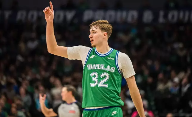 Dallas Mavericks forward Cooper Flagg gestures during an NBA basketball game against the Charlotte Hornets, Thursday, Jan. 29, 2026, in Dallas. (AP Photo/Jessica Tobias)