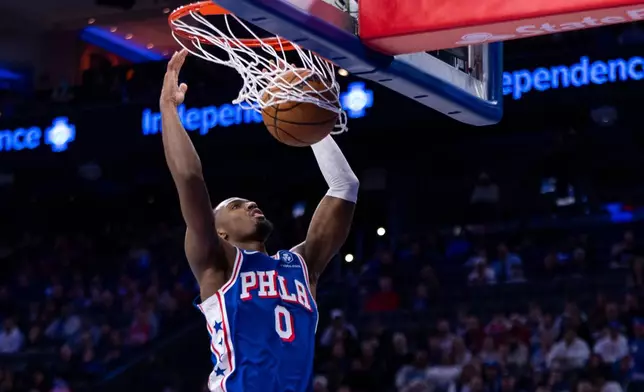 Philadelphia 76ers' Tyrese Maxey dunks during the first half of an NBA basketball game against the Indiana Pacers, Monday, Jan. 19, 2026, in Philadelphia. (AP Photo/Chris Szagola)