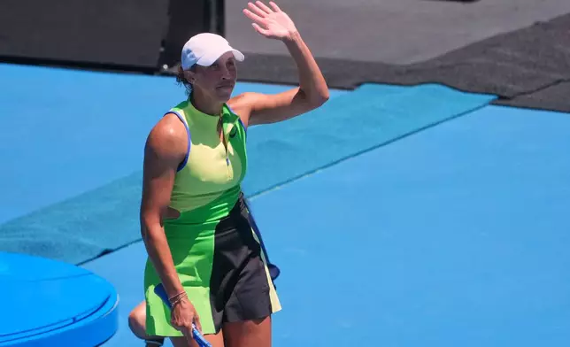 Madison Keys of the U.S. waves after defeating Oleksandra Oliynykova of Ukraine during their first round match at the Australian Open tennis championship in Melbourne, Australia, Tuesday, Jan. 20, 2026. (AP Photo/Asanka Brendon Ratnayake)