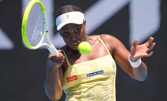 Sloane Stephens of the U.S. plays a forehand return to Karolina Pliskova of Czech Republic during their first round match at the Australian Open tennis championship in Melbourne, Australia, Tuesday, Jan. 20, 2026. (AP Photo/Dita Alangkara)