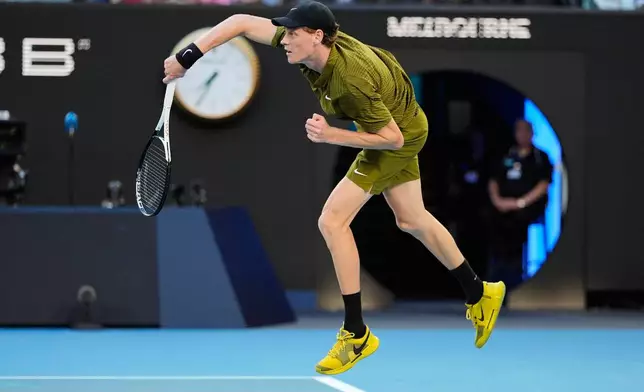 Jannik Sinner of Italy serves to Hugo Gaston of France during their first round match at the Australian Open tennis championship in Melbourne, Australia, Tuesday, Jan. 20, 2026. (AP Photo/Asanka Brendon Ratnayake)