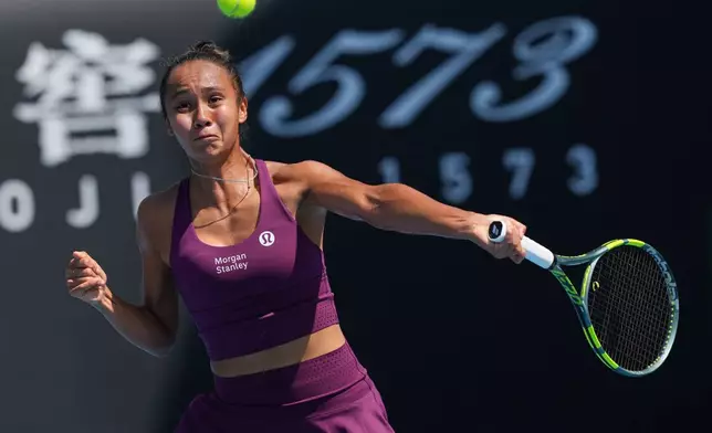 Leylah Fernandez of Canada plays a forehand return to Janice Tjen of Indonesia during their first round match at the Australian Open tennis championship in Melbourne, Australia, Tuesday, Jan. 20, 2026. (AP Photo/Dar Yasin)