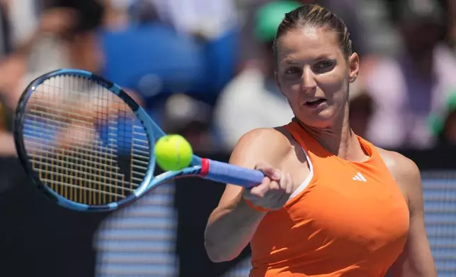 Karolina Pliskova of Czech Republic plays a forehand return to Sloane Stephens of the U.S. during their first round match at the Australian Open tennis championship in Melbourne, Australia, Tuesday, Jan. 20, 2026. (AP Photo/Dita Alangkara)