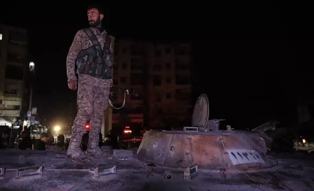 Syrian government forces take over the Achrafieh neighborhood from Kurdish fighters during ongoing clashes that erupted Tuesday in a contested area of the northern city of Aleppo, Syria, early Friday, Jan. 9, 2026. (AP Photo/Omar Albam)