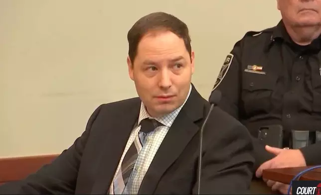 This image taken from video, Brendan Banfield, charged with aggravated murder in the 2023 killings of Christine Banfield and Joseph Ryan, appears in court during opening statements on Tuesday, Jan. 13, 2026 in Fairfax, Va. (Court TV via AP, Pool).