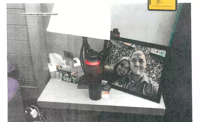 FILE - This image provided by the Fairfax County Police Department and taken on Oct. 13, 2023, was submitted as evidence in the murder case against Brendan Banfield shows a framed photo of Banfield and Juliana Peres Magalhães on his bedside table in Herndon, Va. (Fairfax County Police Department via AP, File)