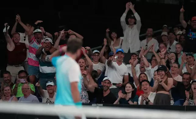 Spectators cheer Stan Wawrinka of Switzerland during his third round match against Taylor Fritz of the U.S. at the Australian Open tennis championship in Melbourne, Australia, Saturday, Jan. 24, 2026. (AP Photo/Asanka Brendon Ratnayake)