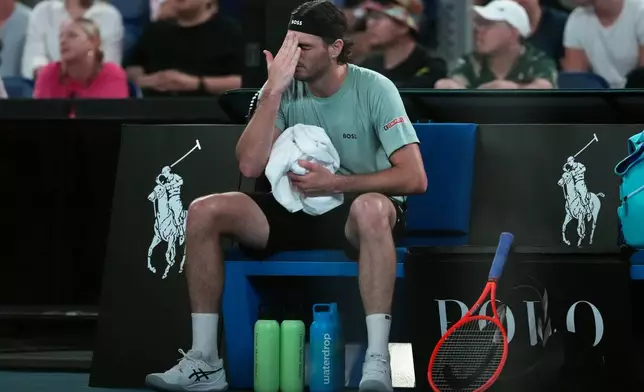 Taylor Fritz of the U.S. reacts during his third round match against Stan Wawrinka of Switzerland at the Australian Open tennis championship in Melbourne, Australia, Saturday, Jan. 24, 2026. (AP Photo/Asanka Brendon Ratnayake)