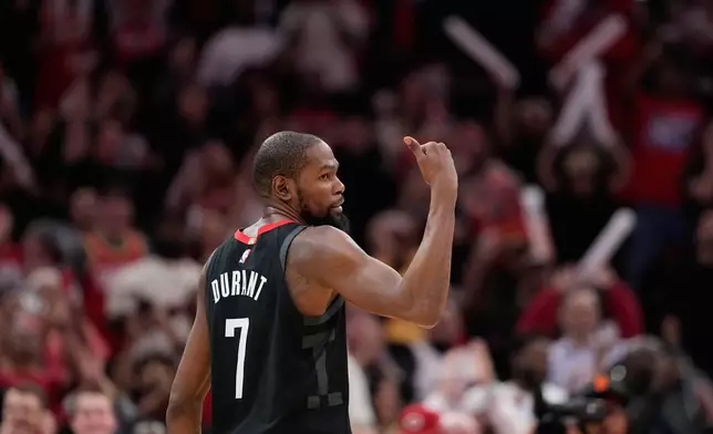 Houston Rockets' Kevin Durant (7) celebrates after making a game-winning 3-point basket against the Phoenix Suns during the second half of an NBA basketball game Monday, Jan. 5, 2026, in Houston. (AP Photo/David J. Phillip)