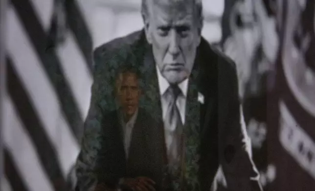 A reflection of the portrait of former President Barack Obama is seen in a photograph of President Donald Trump on display at the Smithsonian's National Portrait Gallery's "American Presidents" exhibit on Sunday, Jan. 11, 2026 in Washington. (AP Photo/Rod Lamkey, Jr.)