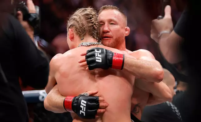 Paddy Pimblett, left, and Justin Gaethje embrace after Gaethje defeated Pimblett in an interim lightweight title fight during the UFC 324 mixed martial arts event Saturday Jan. 24, 2026, in Las Vegas. (AP Photo/Steve Marcus)