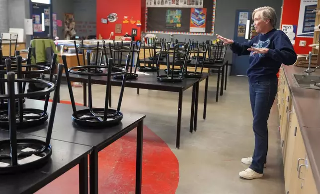 Art teacher Joyce Hatzidakis gets ready to welcome students in her classroom Thursday, Jan. 22, 2026, Riverside, Calif. (AP Photo/Damian Dovarganes)