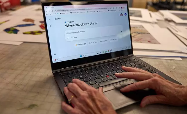 Art teacher Joyce Hatzidakis uses the AI tool Google Gemini in her high school classroom Thursday, Jan. 22, 2026, Riverside, Calif. (AP Photo/Damian Dovarganes)