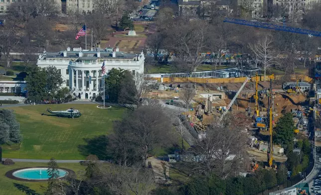 Marine One helicopter is seen on the South Lawn of the White House to transport President Donald Trump to nearby Andrews Air Force Base, as work continues on the construction of the ballroom at the White House, Tuesday, Jan., 13, 2026, in Washington, where the East Wing once stood. (AP Photo/Pablo Martinez Monsivais)