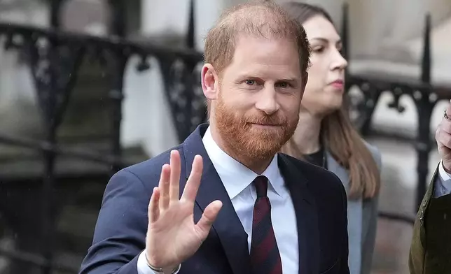 Britain's Prince Harry arrives at London's High Court to lead a group, including Elton John and Elizabeth Hurley, accusing the Daily Mail's publisher of privacy invasion through unlawful tactics in a trial that is part of a wider phone hacking scandal in London, Wednesday, Jan. 21, 2026. (AP Photo/Kirsty Wigglesworth)