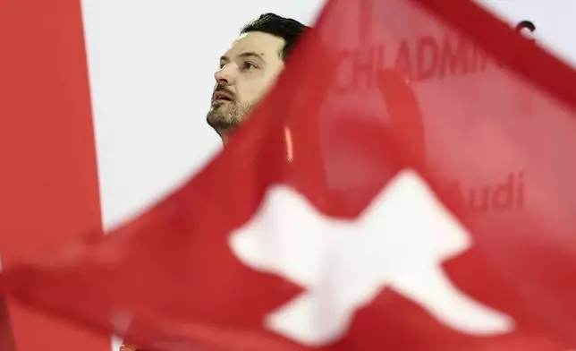 Switzerland's Loic Meillard on the podium after winning an alpine ski, men's World Cup giant slalom in Schladming, Austria, Tuesday, Jan. 27, 2026. (AP Photo/Gabriele Facciotti)