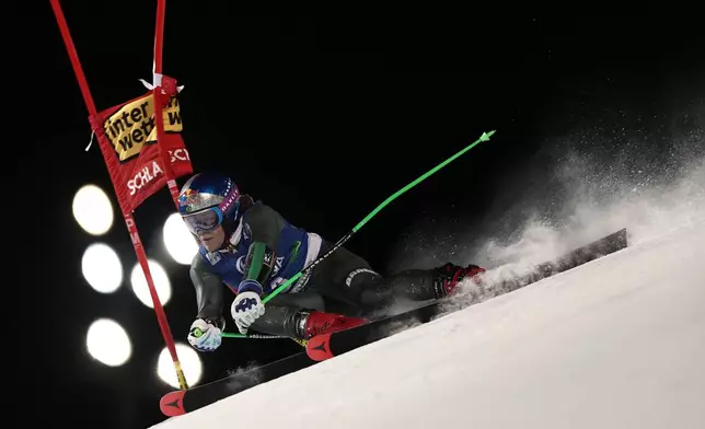 Brazil's Lucas Pinheiro Braathen speeds down the course during an alpine ski, men's World Cup giant slalom in Schladming, Austria, Tuesday, Jan. 27, 2026. (AP Photo/Gabriele Facciotti)