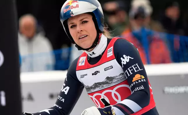 United States' Lindsey Vonn at the finish line after crashing, during an alpine ski, women's World Cup downhill, in Crans Montana , Switzerland, Friday, Jan. 30, 2026. (AP Photo/Giovanni Auletta)