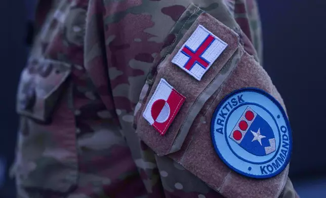 A patch of the Joint Arctic Command is seen on o jacket of Major General Søren Andersen standing onboard a military vessel HDMS Knud Rasmussen of the Royal Danish Navy docked in Nuuk, Greenland, on Saturday, Jan. 17, 2026. (AP Photo/Evgeniy Maloletka)