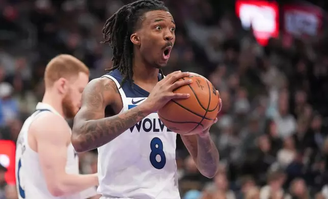 Minnesota Timberwolves guard Bones Hyland (8) reacts to a call during the first half of an NBA basketball game between the Utah Jazz and the Minnesota Timberwolves Tuesday, Jan. 20, 2026, in Salt Lake City. (AP Photo/Bethany Baker)