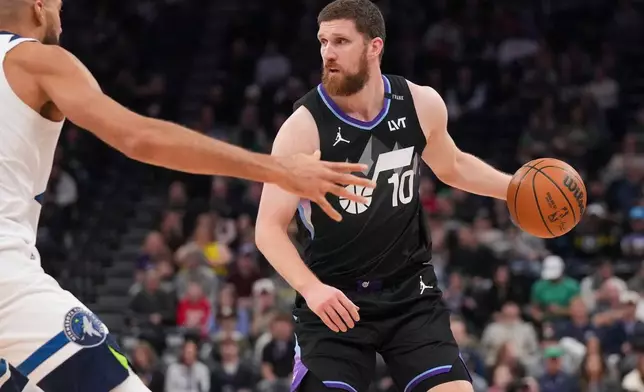 Utah Jazz guard/forward Svi Mykhailiuk (10) looks to pass during the first half of an NBA basketball game between the Utah Jazz and the Minnesota Timberwolves Tuesday, Jan. 20, 2026, in Salt Lake City. (AP Photo/Bethany Baker)