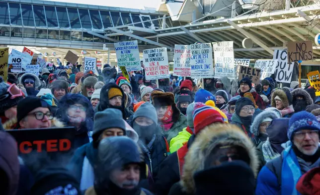 Clergy members and community activists gather at the Minneapolis-St. Paul International Airport, to protest deportation flights and urge airlines to call for an end to the Department of Homeland Security's operation, on Friday, Jan. 23, 2026, in St. Paul, Minn. (Kerem Yücel/Minnesota Public Radio via AP)
