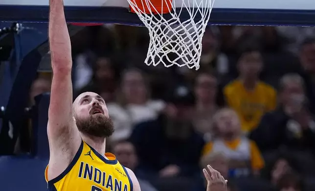 Indiana Pacers center Jay Huff (32) shoots against the New Orleans Pelicans during the first half of an NBA basketball game in Indianapolis, Friday, Jan. 16, 2026. (AP Photo/Michael Conroy)